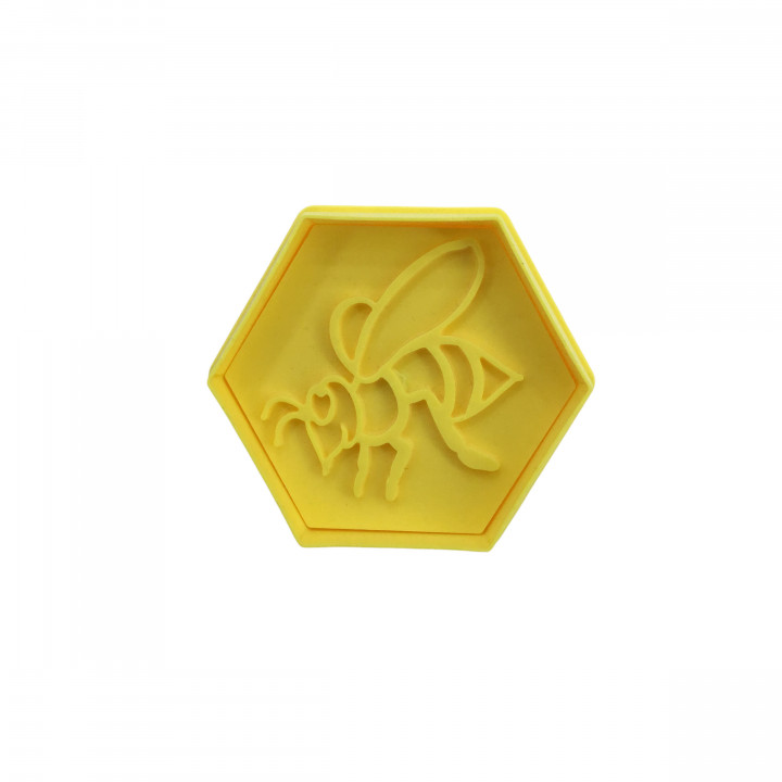 Emporte-pièces/cachet hexagonal avec motif abeilles